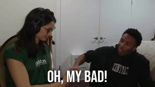 A Woman Wearing A Green Adidas Shirt Talks To A Man GIF