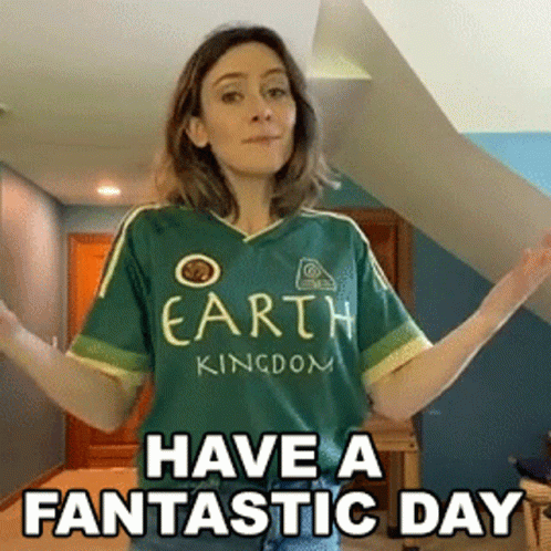 A Woman Wearing A Green Shirt That Says " Earth Kingdom " GIF