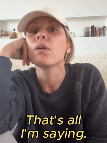 A Woman Wearing A Hat And A Black Sweater Says That 'S All I 'M Saying GIF