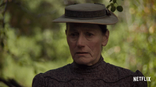 A Woman Wearing A Hat And A Netflix Logo On The Bottom GIF