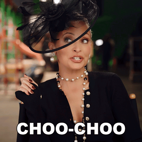 A Woman Wearing A Hat And Pearls Says Choo-Choo On The Bottom GIF