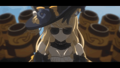 A Woman Wearing A Hat And Sunglasses Is Standing In Front Of A Bunch Of Barrels GIF