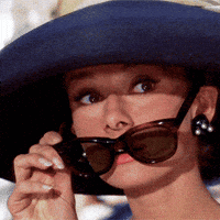 Woman Wearing Hat And Sunglasses Looking At Something GIF