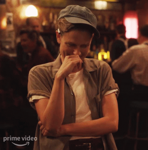 Woman Laughing In Bar With Prime Video Text GIF