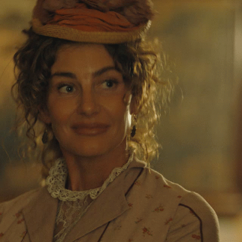 A Woman Wearing A Hat Is Smiling And Says I Can Do That GIF