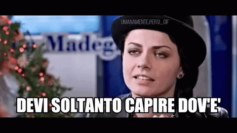 A Woman Wearing A Hat Says Devi Soltanto Capire Dove 'E GIF