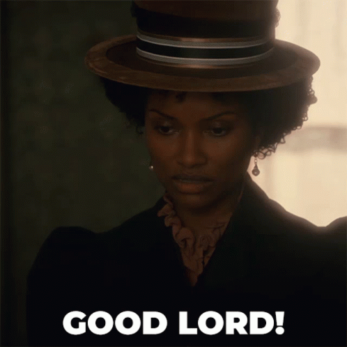 A Woman Wearing A Hat Says Good Lord On The Bottom GIF