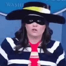 A Woman Wearing A Hat , Sunglasses , And A Tie . GIF