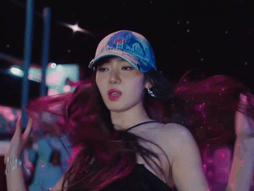 A Woman Wearing A Hat That Says ' Nyc ' On It GIF