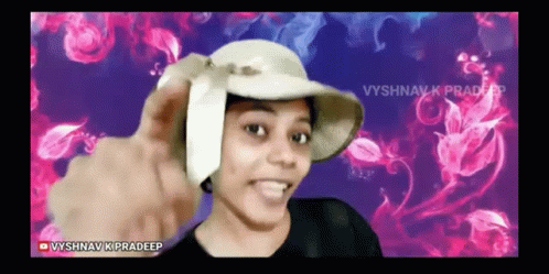 A Woman Wearing A Hat With The Name Vyshnav K Pradeep At The Bottom GIF