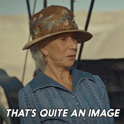 A Woman Wearing A Hat With The Words That 'S Quite An Image Behind Her GIF
