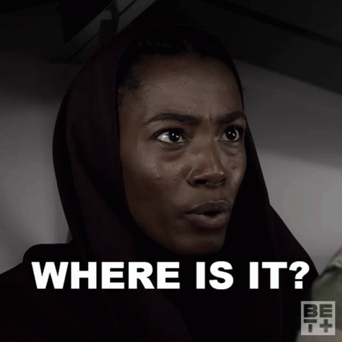 A Woman Wearing A Head Scarf Is Asking Where Is It GIF