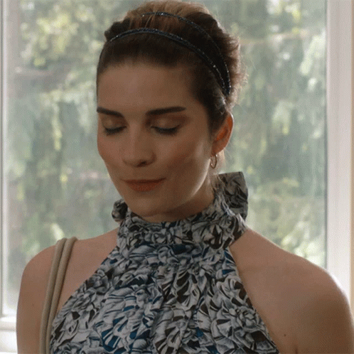 Woman Looking Down With Headband GIF