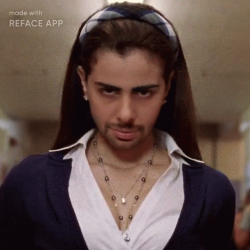 A Woman Wearing A Headband And A Necklace Has A Beard Made With Reface App GIF