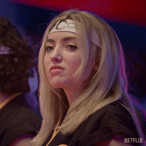 A Woman Wearing A Headband With The Letter C On It Is Featured On Netflix GIF