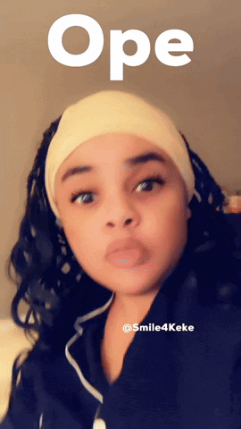 A Woman Wearing A Headband With The Word Ope Written Above Her GIF