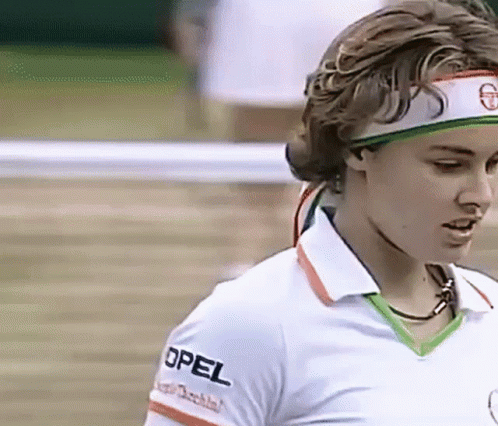 A Woman Wearing A Headband With The Word Opel On The Sleeve Of Her Shirt GIF