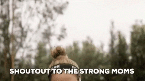 A Woman Wearing A Headband With The Words `` Shout Out To The Strong Moms '' Written On It . GIF