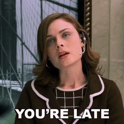 A Woman Wearing A Headset With The Words You 'Re Late Below Her GIF