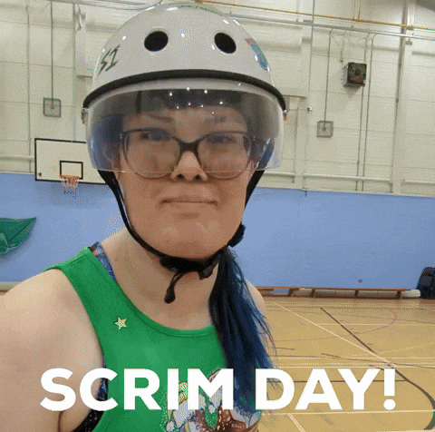 A Woman Wearing A Helmet And Glasses Has The Words Scrim Day Written Below Her GIF