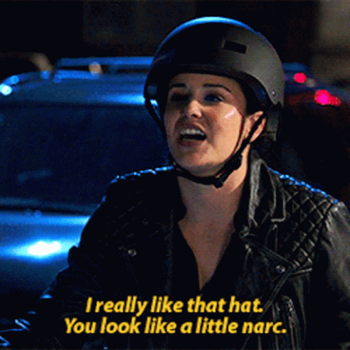 a woman wearing a helmet says i really like that hat you look like a little narco