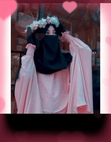 A Woman Wearing A Hijab And A Flower Crown GIF