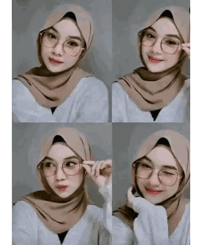 a woman wearing a hijab and glasses is taking a picture of herself .