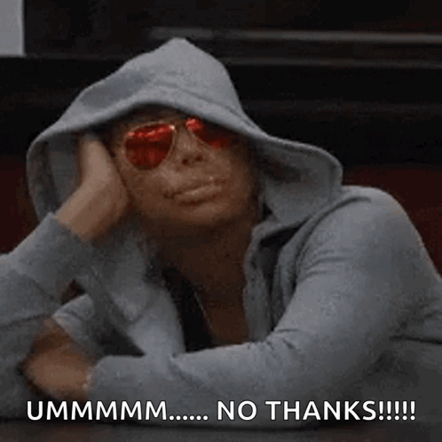 A Woman Wearing A Hoodie And Sunglasses Is Sitting At A Table With Her Head On Her Hand . GIF