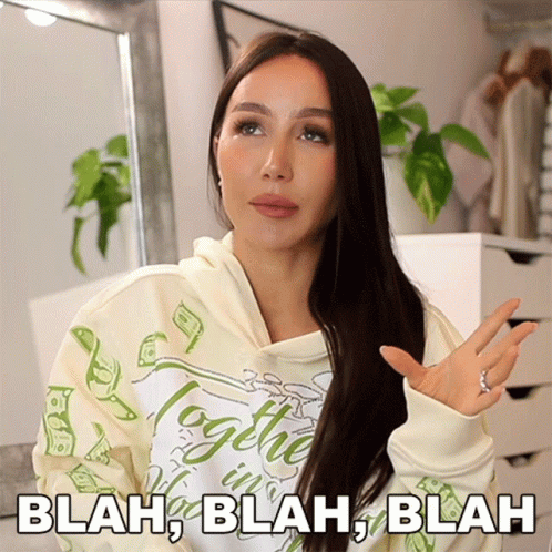 A Woman Wearing A Hoodie That Says Blah Blah Blah On It GIF