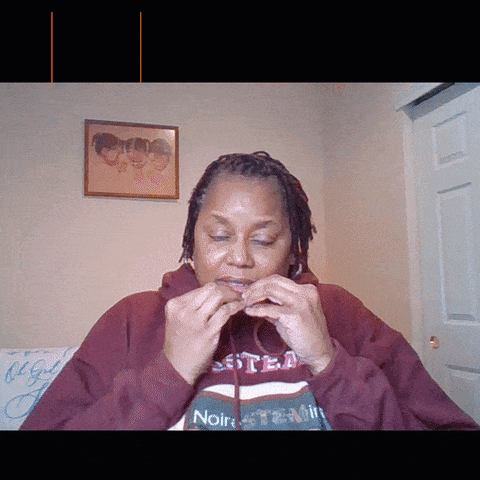 A Woman Wearing A Hoodie That Says Noir GIF