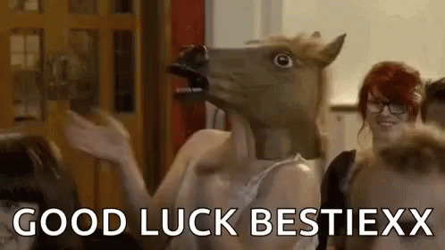 A Woman Wearing A Horse Head Mask Is Dancing In A Room With Other People . GIF