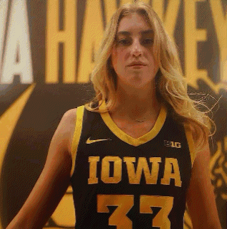 a woman wearing a iowa jersey number 77
