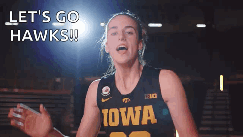 A Woman Wearing A Iowa Jersey Says Let 'S Go Hawks ! GIF
