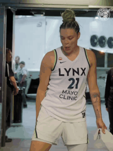 A Woman Wearing A Jersey That Says Lynx Mayo Clinic GIF