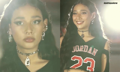 A Woman Wearing A Jordan 23 Jersey Smiles GIF