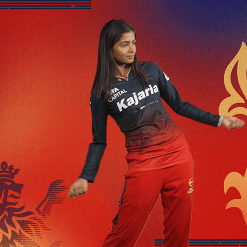 a woman wearing a kajaria jersey is dancing