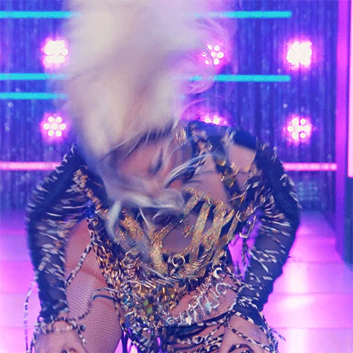 Woman In Leopard Print Dancing On Stage GIF