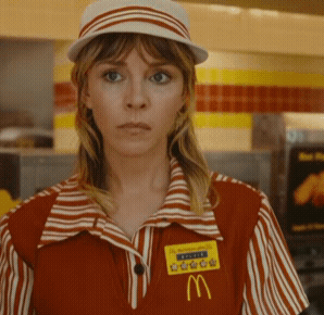 A Woman Wearing A Mcdonald 'S Uniform Has A Name Tag With The Letter M GIF