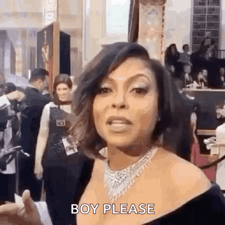A Woman Wearing A Necklace And A Black Dress Is Standing In Front Of A Crowd . GIF