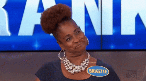 A Woman Wearing A Necklace And A Name Tag That Says Brigitte GIF