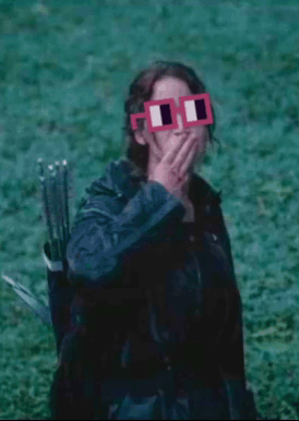 A Woman Wearing A Pair Of Pink Square Glasses Covering Her Mouth GIF