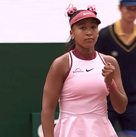 A Woman Wearing A Pink Dress And A Pink Nike Visor GIF