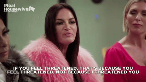 A Woman Wearing A Pink Fur Coat Says If You Feel Threatened GIF