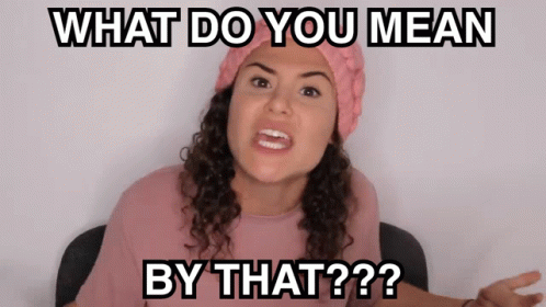 A Woman Wearing A Pink Hat And A Pink Shirt Says What Do You Mean By That GIF