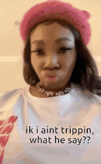 A Woman Wearing A Pink Hat And A White Shirt With The Words `` Ik I Aint Trippin , What He Say '' . GIF