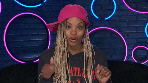 A Woman Wearing A Pink Hat And An Atlanta Sweatshirt GIF