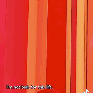 A Woman Wearing A Pink Robe With A Hood Says I 'M A Soft Gal . GIF