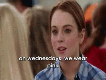 A Woman Wearing A Plaid Shirt Is Talking About Wearing Pink On Wednesdays . GIF