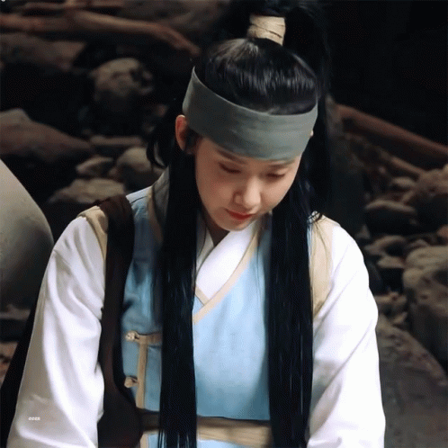 A Woman Wearing A Ponytail And A Headband With The Letters Eeea On The Bottom GIF