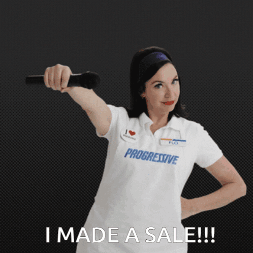 A Woman Wearing A Progressive Shirt Holds A Microphone GIF
